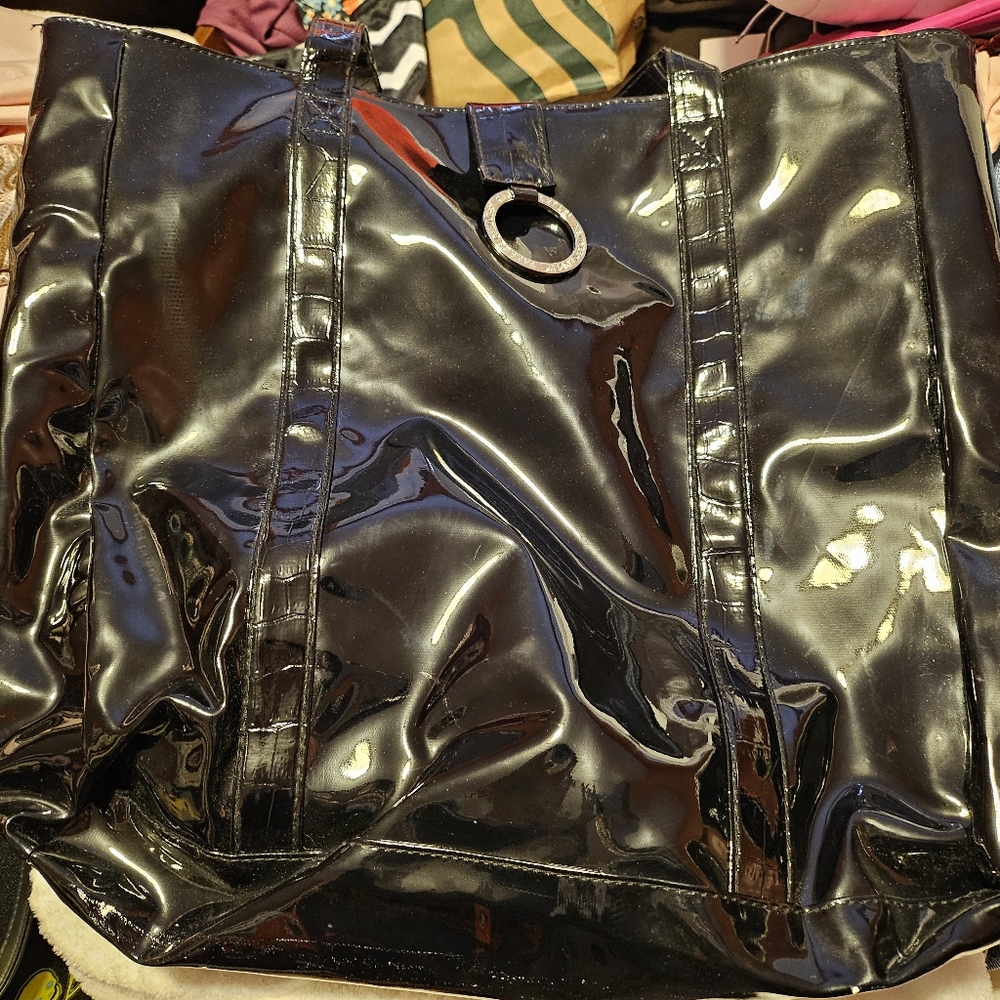 A used black patent Yankee Candle tote